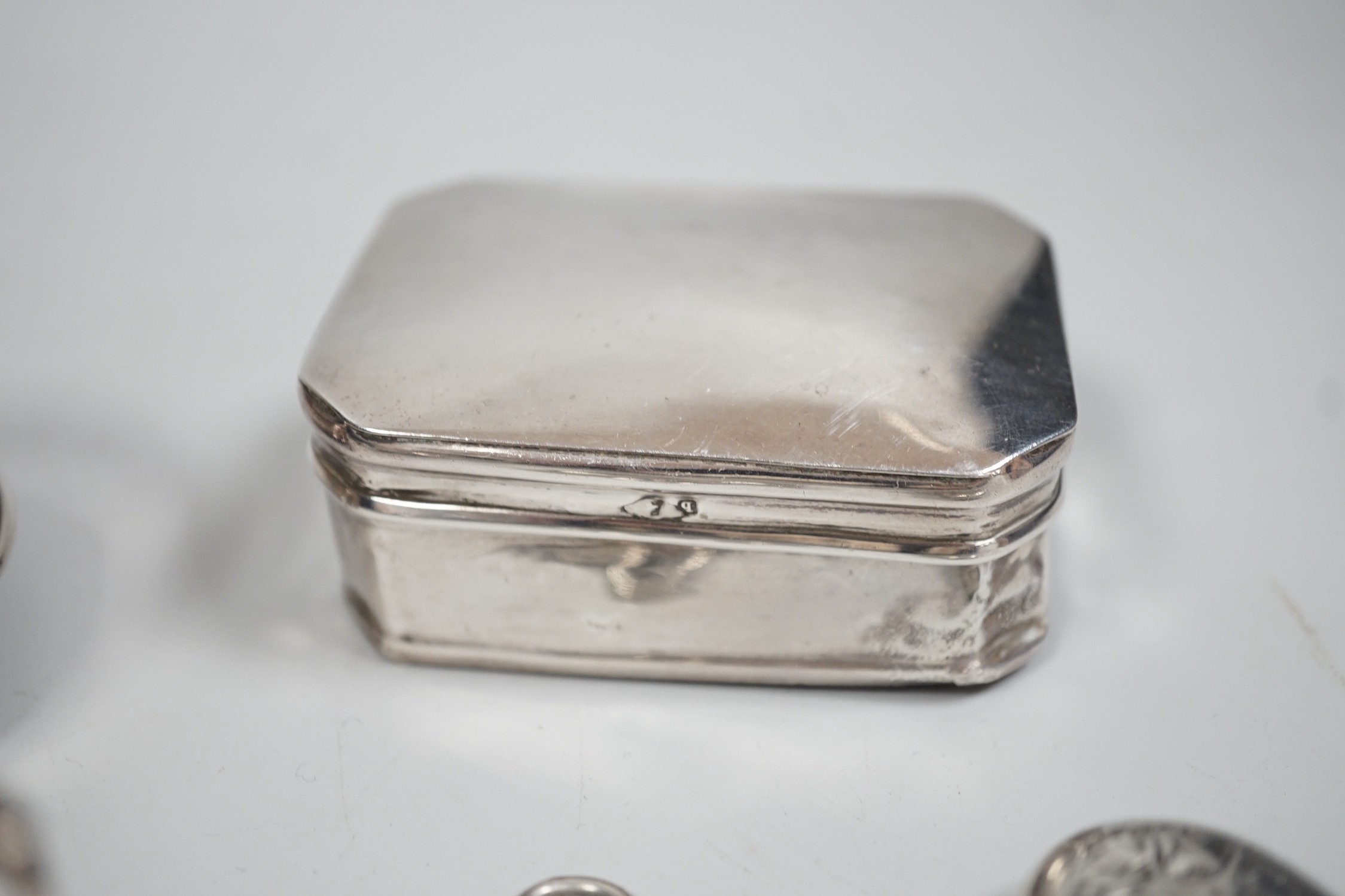 A collection of small silver items including two trinket boxes, a damaged mustard pot, two vesta case, snuff box etc. and a white metal box.